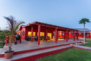 the bright and charming lodge welcomes guests with spectacular sunsets