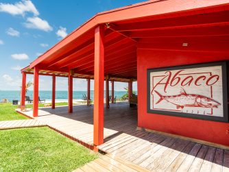 the bright charming lodge welcomes guests with spectacular waterfront views