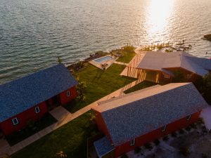 the bright and charming lodge welcomes guests with spectacular sunsets